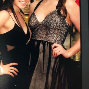 Fun party dress. Black over a nude colored dress.